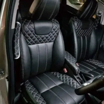 Seat Covers: Black seat covers with white stitching